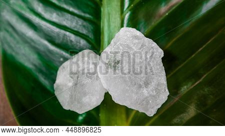 Crystal Clear Alum Cubes Or Potassium Alum On Green Leaf. Chemical Compound Substance. Concept For B