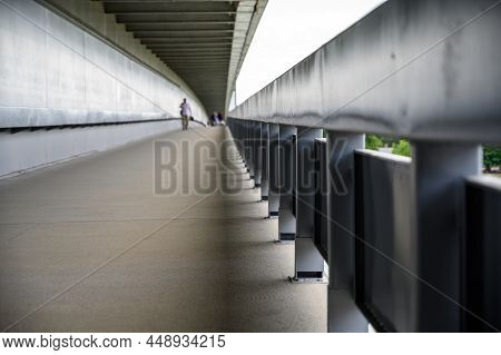 Bratislava, Slovakia - July 9, 2019: Handrail Along Footpath On Most Snp Bridge With People Out Of F