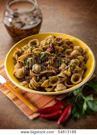integral orecchiette with dried tomatoes, selective focus