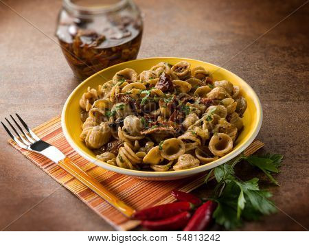 integral orecchiette with dried tomatoes, selective focus