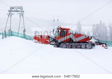 Snowplow Working On A Ski Slope