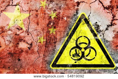 Old Cracked Wall With Biohazard Warning Sign And Painted Flag