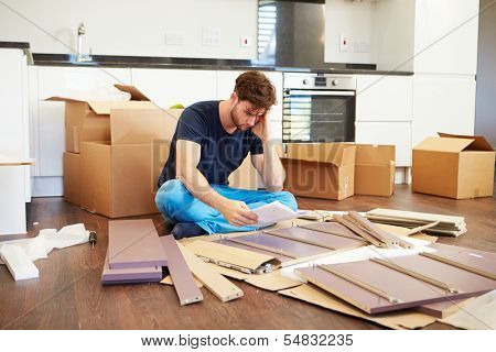Frustrated Man Putting Together Self Assembly Furniture