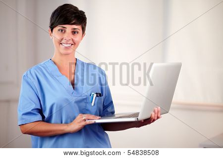 Female Latin Doctor Working On Her Laptop