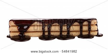 Stream chocolate on stics of biscuit.