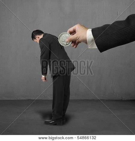 Hand Hold Money To Put Into Hole On Businessman's Back