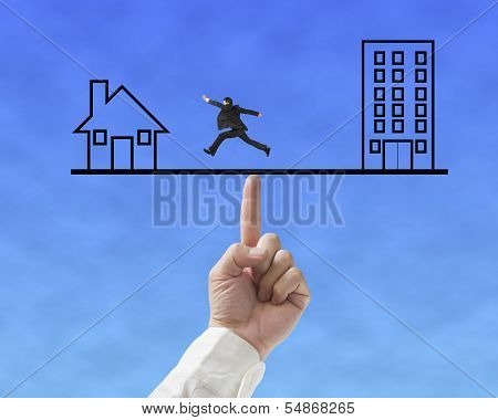 Office And Home On Seesaw Drawing With One Businessman Running