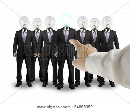 Hand Point Out One Businessman With Lighting Bulb Head