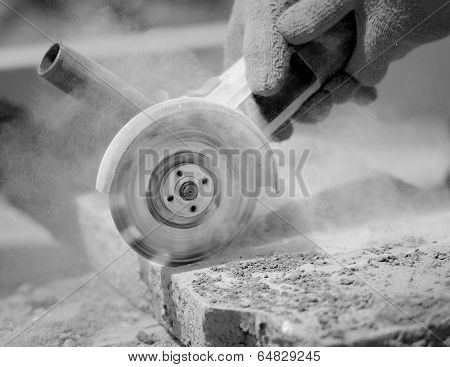 Grinder Worker Cuts A Stone