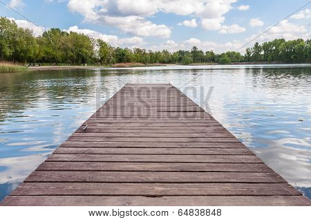 Old Wooden Jetty At A Lake