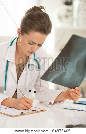 Medical Doctor Woman With Fluorography Working In Office