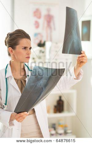 Medical Doctor Woman Looking On Fluorography In Office