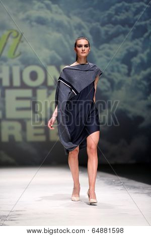ZAGREB, CROATIA - MAY 09: Fashion model wearing clothes designed by Iva Karacic on the Zagreb Fashion Week on May 09, 2014 in Zagreb, Croatia.