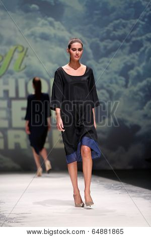 ZAGREB, CROATIA - MAY 09: Fashion model wearing clothes designed by Iva Karacic on the Zagreb Fashion Week on May 09, 2014 in Zagreb, Croatia.