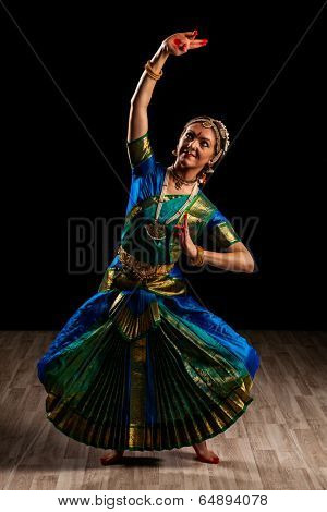 Young beautiful woman dancer exponent of Indian classical dance Bharatanatyam