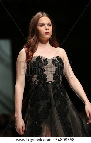ZAGREB, CROATIA - MAY 09: Fashion model wearing clothes designed by Avaro Figlio on the Zagreb Fashion Week on May 09, 2014 in Zagreb, Croatia.