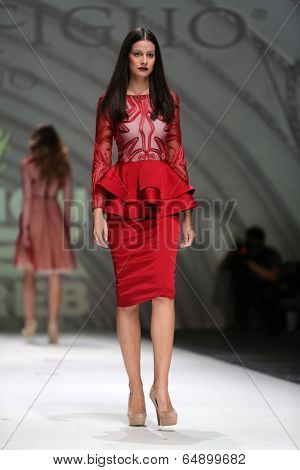 ZAGREB, CROATIA - MAY 09: Fashion model wearing clothes designed by Avaro Figlio on the Zagreb Fashion Week on May 09, 2014 in Zagreb, Croatia.