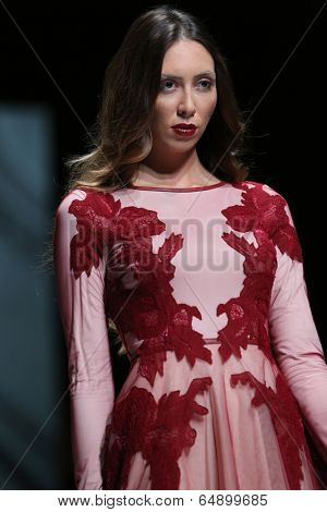 ZAGREB, CROATIA - MAY 09: Fashion model wearing clothes designed by Avaro Figlio on the Zagreb Fashion Week on May 09, 2014 in Zagreb, Croatia.