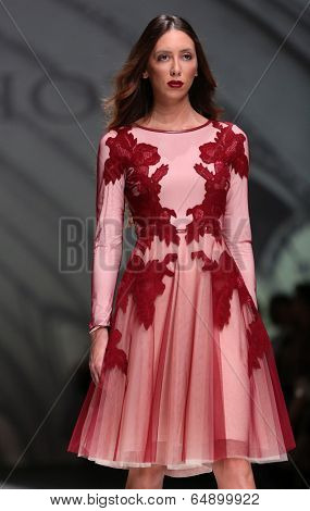 ZAGREB, CROATIA - MAY 09: Fashion model wearing clothes designed by Avaro Figlio on the Zagreb Fashion Week on May 09, 2014 in Zagreb, Croatia.