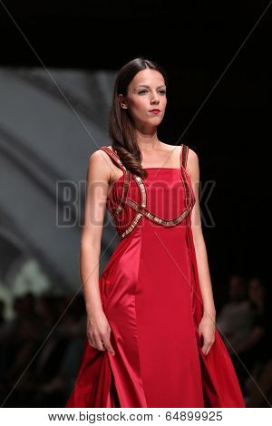 ZAGREB, CROATIA - MAY 09: Fashion model wearing clothes designed by Avaro Figlio on the Zagreb Fashion Week on May 09, 2014 in Zagreb, Croatia.