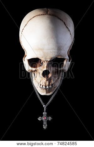Human skull with silver cross