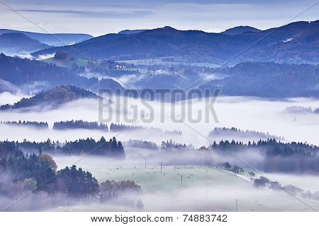 Hilly Landscape With Fog
