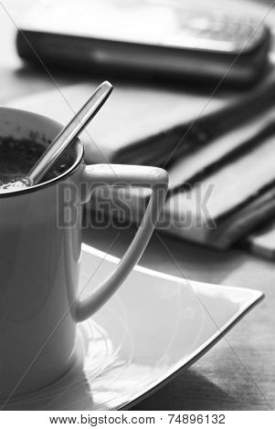 Black coffee and newspaper. Breakfast