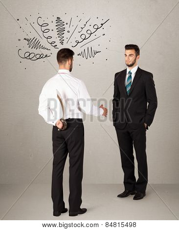 Ruthless businessman handshake with a hiding weapon and drawn curly lines around his head 
