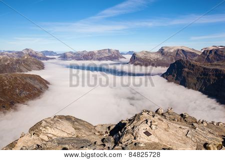 View from Dalsnibba mountain to clouds over Geiranger in Norway