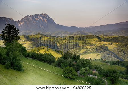 Pale of light. Morning on mountain hills. Holbav
