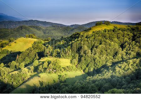 Pale of light. Morning on mountain hills. Holbav