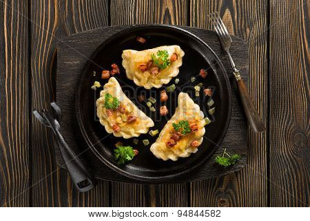 Fried Dumplings With Onion And Bacon Top View