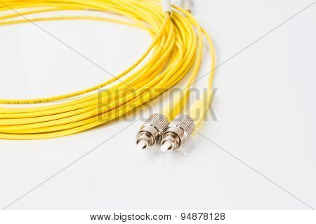 Close up of a fiber optic patchcord on white background