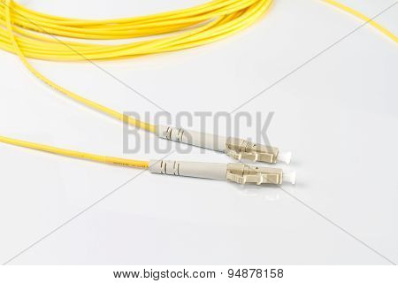 Close up of a fiber optic patchcord on white background