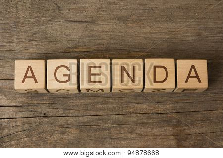 AGENDA text on a wooden background