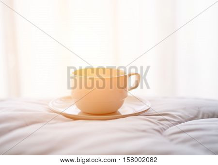 Fresh morning with coffee on the bed.