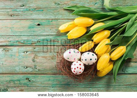 Easter Background Yellow Tulips On Wooden Table, Rabbit, Eggs,nest Candy