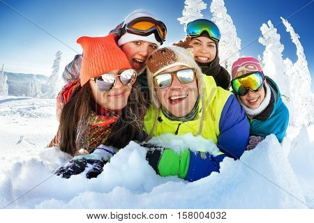 Group of happy friends having fun. Snowbarders and skiers group team friendship. Sheregeshs ski resort