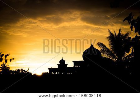 Silhouette of Mosque in Langawi, Malaysia at sunset. Islam is the state religion of Malaysia