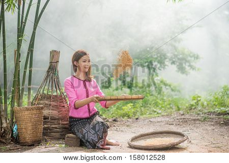 Beautiful Thai Asian Women Winnow Rice Separate Between Rice And Rice Chaff Identity . In Traditiona