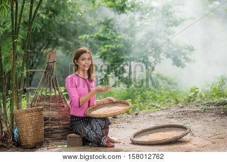 Beautiful Thai Asian Women Winnow Rice Separate Between Rice And Rice Chaff Identity . In Traditiona
