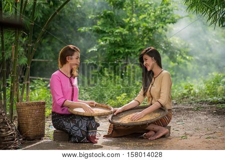 Beautiful Thai Asian Women Winnow Rice Separate Between Rice And Rice Chaff Identity . In Traditiona