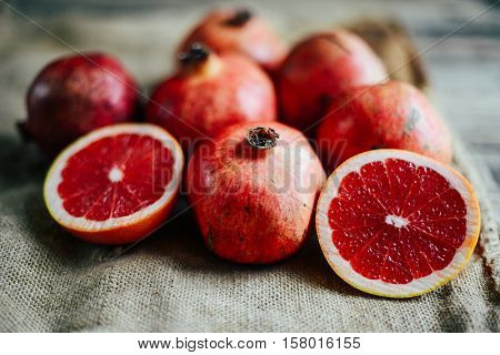 Ripe Pomegranate Fruit On Wooden Vintage Background. Red Juice P