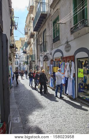 AMALFI TOWN SOUTH ITALY - NOVEMBER 5 : toursit walking in narrow street in amalfi town important traveling destination of mediterranean coast line on november 5 2016 in amalfi town south italy
