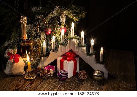 Christmas candles and gifts. Traditional Christmas candolier.