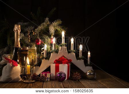 Christmas candles and gifts. Traditional Christmas candolier.