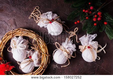 Retro textile Christmas baubles with white lace and rope