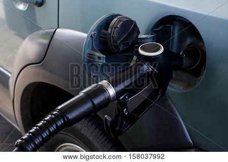 car fill with gasoline at a gas station