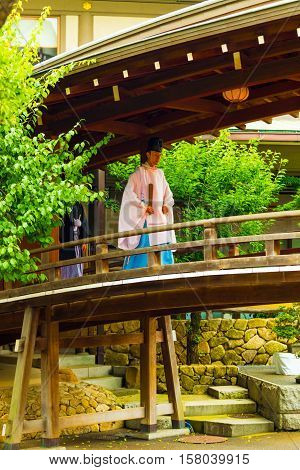 Shinto Priest Kannushi Robe Walking Wooden Bridge