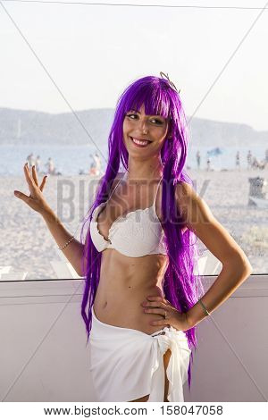 QUARTU S.E., ITALY - August 2, 2015: Beach Cosplay Party - costume parade held at the Marlin Club of Poetto Beach - Sardinia - portrait of a beautiful smiling girl in cosplay costume